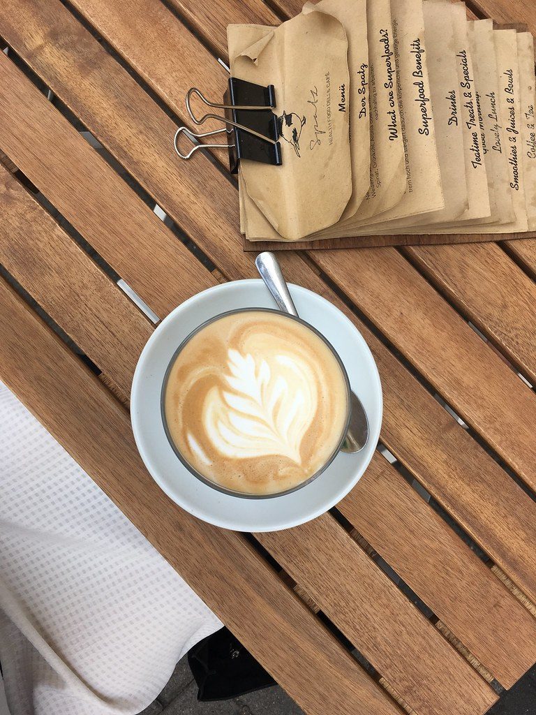A flat white poured with latte art